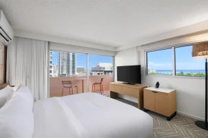 A photo of The Ambassador Hotel of Waikiki, Tapestry Collection by Hilton showing the property and rooms.