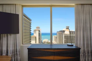 A photo of Embassy Suites by Hilton Waikiki Beach Walk showing the property and rooms.