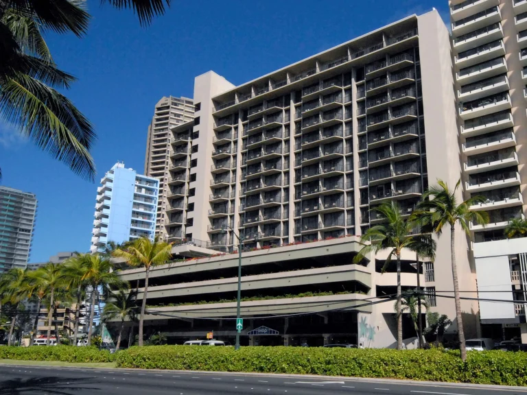 A photo of Castle at Palms at Waikīkī showing the property and rooms.