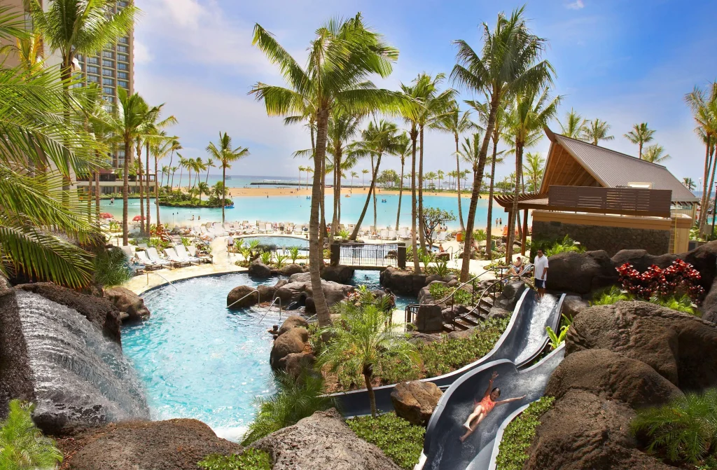 A photo of Hilton Hawaiian Village Waikiki Beach Resort showing the property and rooms.