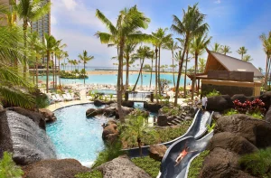 A photo of Hilton Hawaiian Village Waikiki Beach Resort showing the property and rooms.