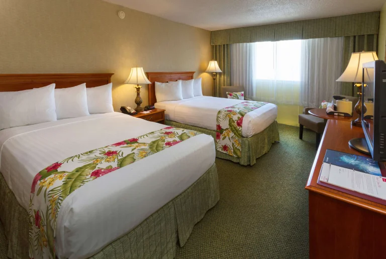 A photo of Ramada Plaza by Wyndham Waikiki showing the property and rooms.