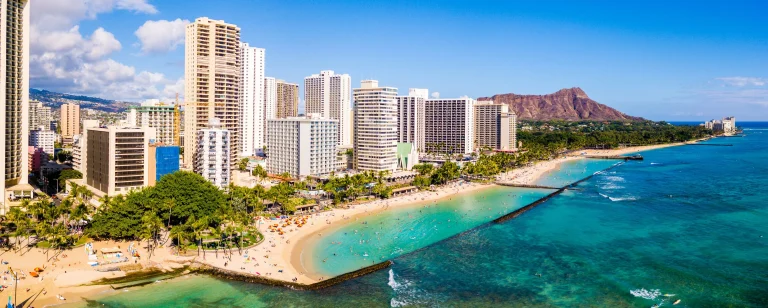 A photo of Waikiki Monarch Hotel showing the property and rooms.