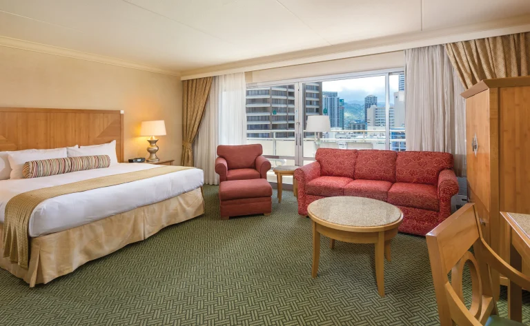 A photo of Waikiki Monarch Hotel showing the property and rooms.