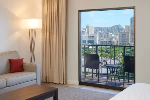 A photo of Coconut Waikiki Hotel showing the property and rooms.