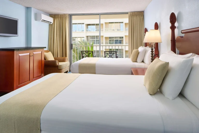 A photo of Ewa Hotel Waikiki showing the property and rooms.