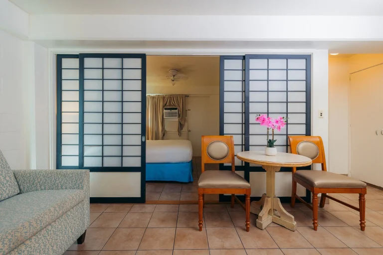 A photo of Waikiki Heritage Hotel showing the property and rooms.