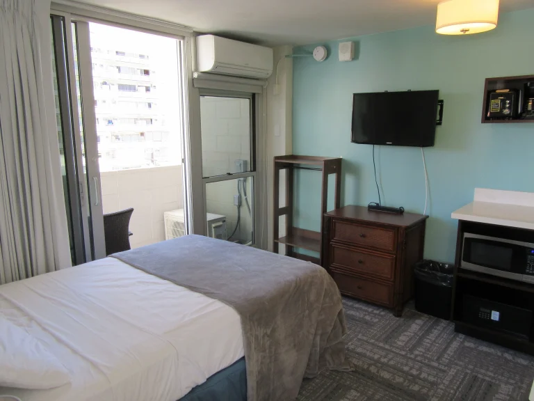 A photo of Waikiki Central Hotel showing the property and rooms.