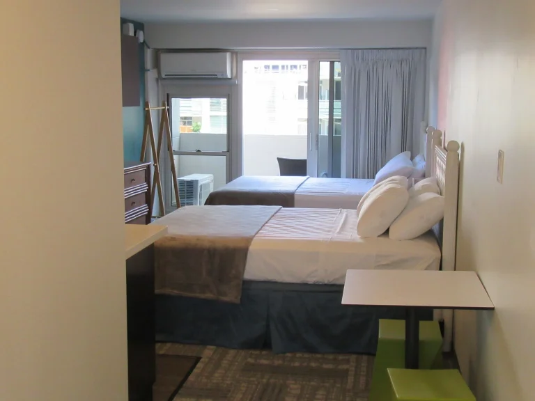A photo of Waikiki Central Hotel showing the property and rooms.